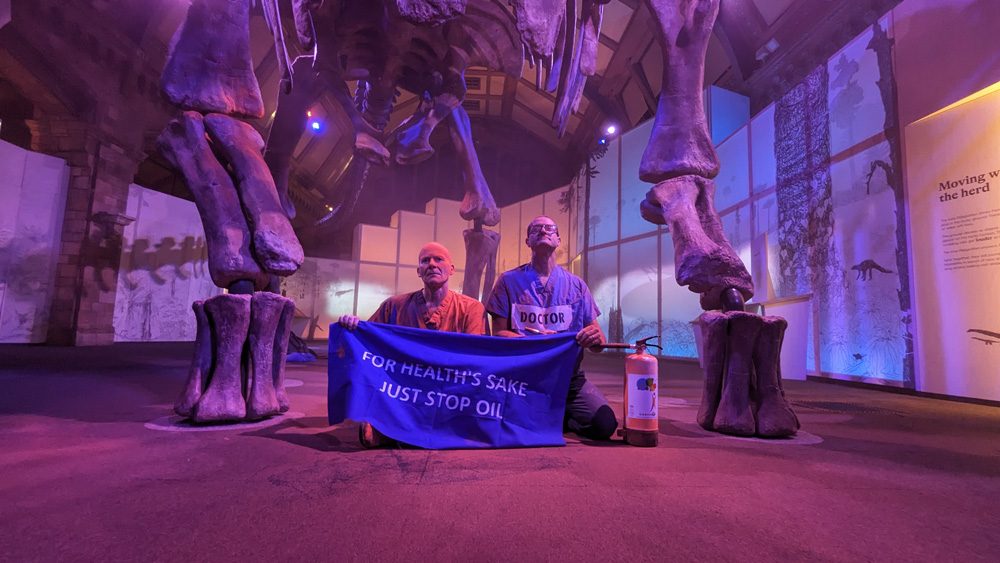 Climate Protestors Spray Orange Cornstarch on Dinosaur Skeleton at London`s Natural History Museum