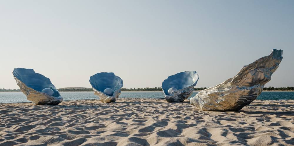 Farah al qasimi`s iridescent oyster sculptures chant hums of longing along abu dhabi corniche