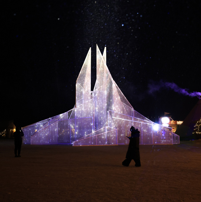 White flame installation`s sharp geometry resembles ice crystals along lake in china